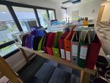many folders on a shelf in a room