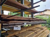 several pieces of wood are stacked on top of each other in a warehouse