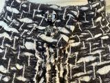 a close up of a black and white jacket on a mannequin mannequin