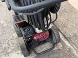 an image of a hose is attached to a power washer