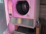 a washing machine and a dryer in a room