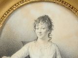 portrait of a woman in a white dress sitting in a chair with a dog