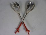 two spoons that are sitting next to each other