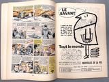 an open comic book with a drawing of a bird on it