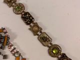 two bracelets that are sitting on a table