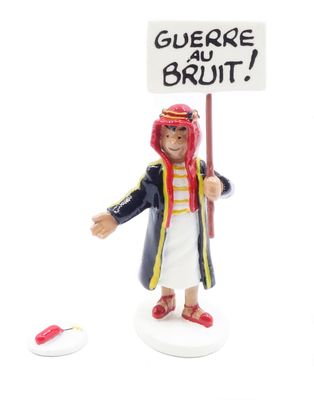 a figurine of a man holding a sign