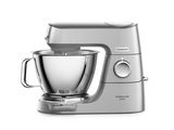 an image of a silver mixer sitting on top of a white counter
