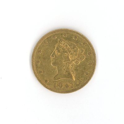a gold coin with a picture of a woman on it
