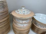 a lot of plates and bowls stacked on top of each other