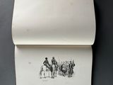 an open book with a drawing of a man on a horse