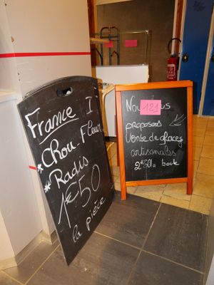 a chalk board with writing on it next to a chalk board with writing on it