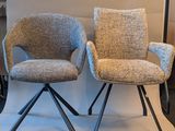 two chairs that are sitting next to each other
