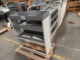 a lot of metal shelves that are stacked on top of each other