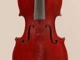 an old violin with a bow hanging from it ' s back