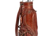 an old leather golf bag with clubs in it on a white background