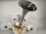 an image of a silver and glass chandelier with a horn