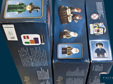 three boxes of legos that are sitting on a table