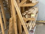 several pieces of wood are stacked on top of each other in a warehouse