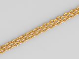 a close up of a gold chain on a white background