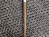 a knife that is laying on top of a piece of metal