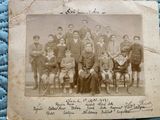 an old photo of a group of people posing for a picture