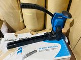 a box with a stapler on it next to some rolls of paper