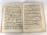 a book with music written in it on a table