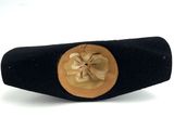 a close up of a black belt with a flower on it