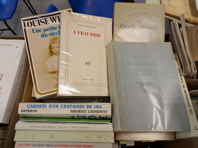 several books are stacked on top of each other on a table