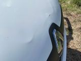 a close up of a car ' s hood with the hood up