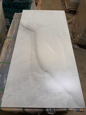 a picture of a white marble slab on a pallet in a warehouse