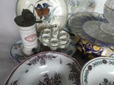 many plates and bowls that are sitting on a table