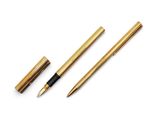 a gold pen and a black pen sitting on top of a white surface