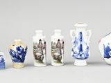 many different vases that are sitting on a table