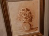 a painting of a vase of flowers on the wall