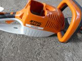 a chainsaw that is laying on the ground