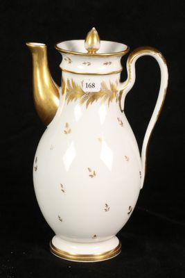 a white and gold coffee pot on a black background