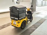 a motorcycle with a cart attached to the back of it