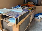 a workbench in a garage with a lot of clutter on it