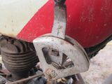 a close up of a motorcycle with a red and white front wheel