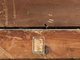 a close up of a piece of wood with a picture on it