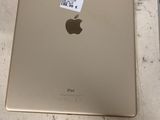an apple ipad with a sticker on it sitting on a table