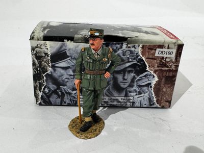 figurine of a man in a military uniform with a cane in front of a box