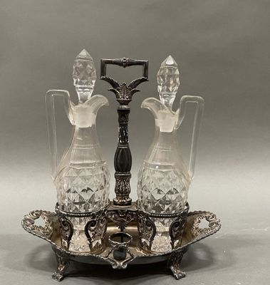 a silver plate with two crystal decanters on it