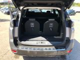 two seats in the back of a car with the trunk open