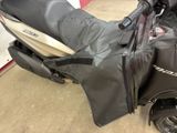 a black and white scooter parked in a garage