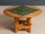 a small table with a green tile on it