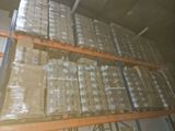 a large amount of boxes stacked on a shelf in a warehouse