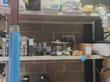 a room with a lot of boxes and boxes on the shelves