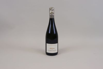 a bottle of wine that is sitting on a table